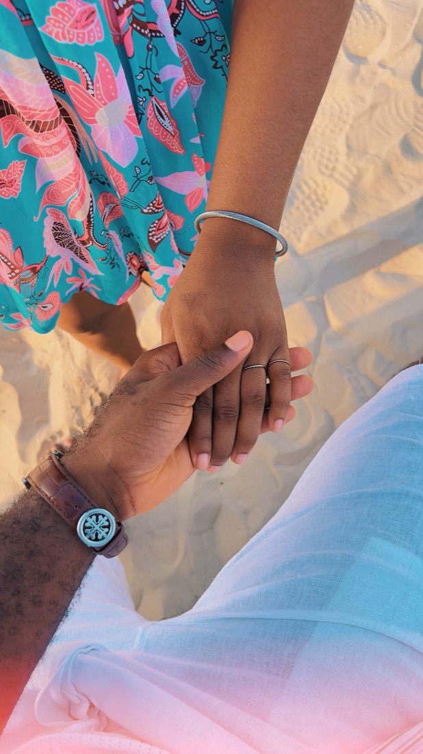 Holding hands on the beach