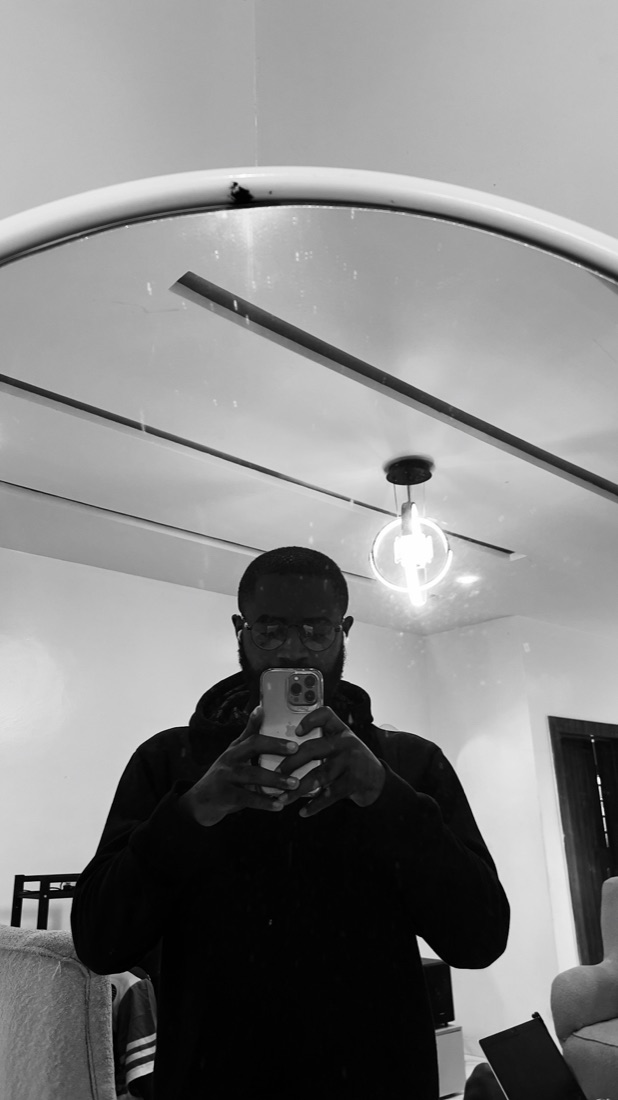 A black-and-white mirror selfie